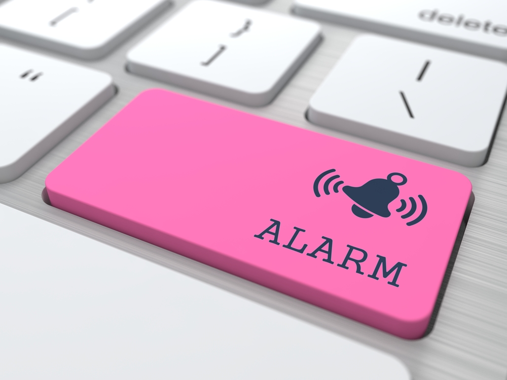 Security Concept - The Red Alarm Button on Modern Computer Keyboard. 3D Render.